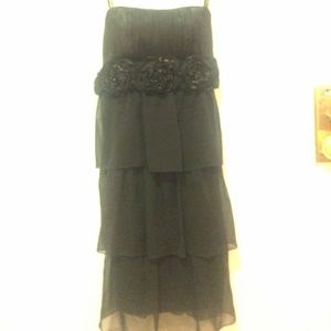 Black cocktail dress with flower detail